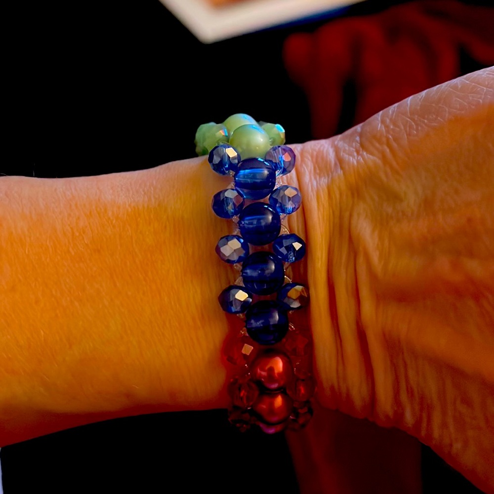 Handmade stretchy bracelet with green, red, blue pearl beads and sparkly beads